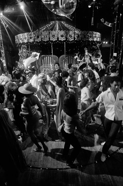 Dancers in front of the merry-go-round at Electric Circus