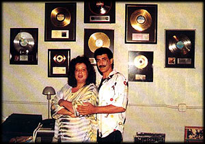 Judy Weinstein and Pooch in front of the Pools Gold Records