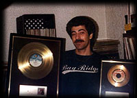 Pooch with Gold Records for Sylvester and Patrick Hernandez
